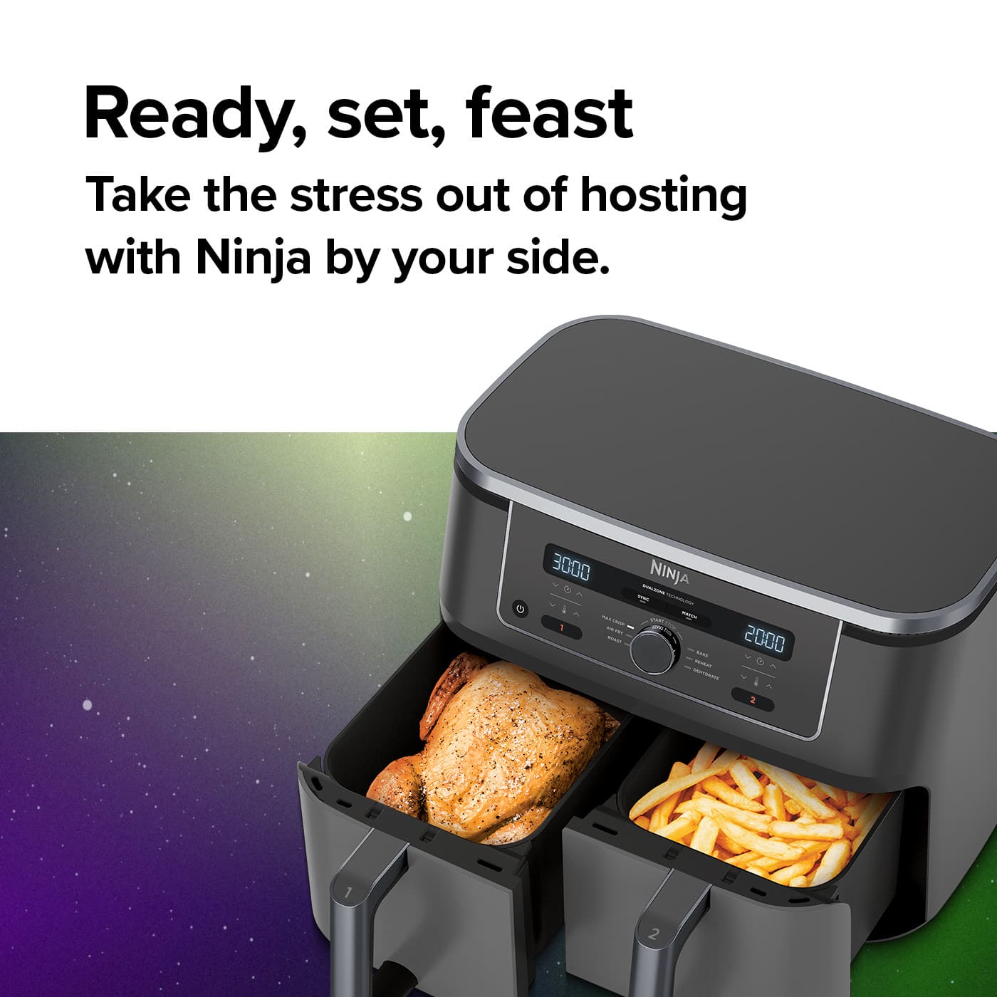Ninja Double Drawer Air Fryer with whole chicken and chips cooking in the drawers